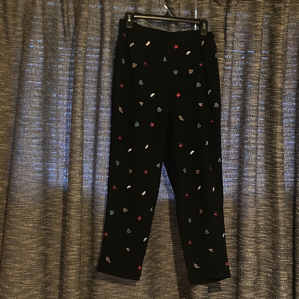 Draper’s and Damon’s black pants with sea theme embroidered pattern.